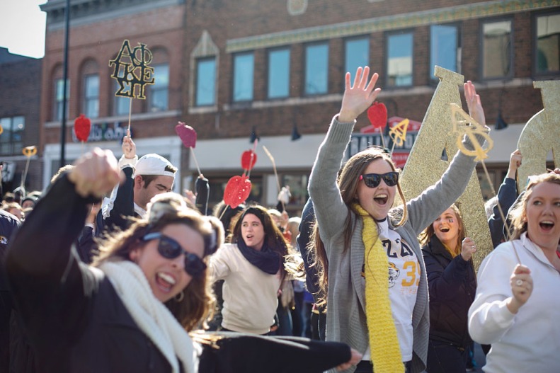 Members of an MU sorority walk during the parade on Saturday, October 26, 2013.